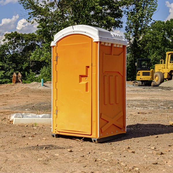 what is the cost difference between standard and deluxe portable restroom rentals in Bourneville